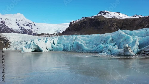 Wallpaper Mural Glacier nearby. Aerial: Close up of Largest Glacier in Europe. Iceland Sunny day. Ridges with black ash. Melting ice. Global warming concept. Drone outdoor. Mountains ice landscape. Torontodigital.ca