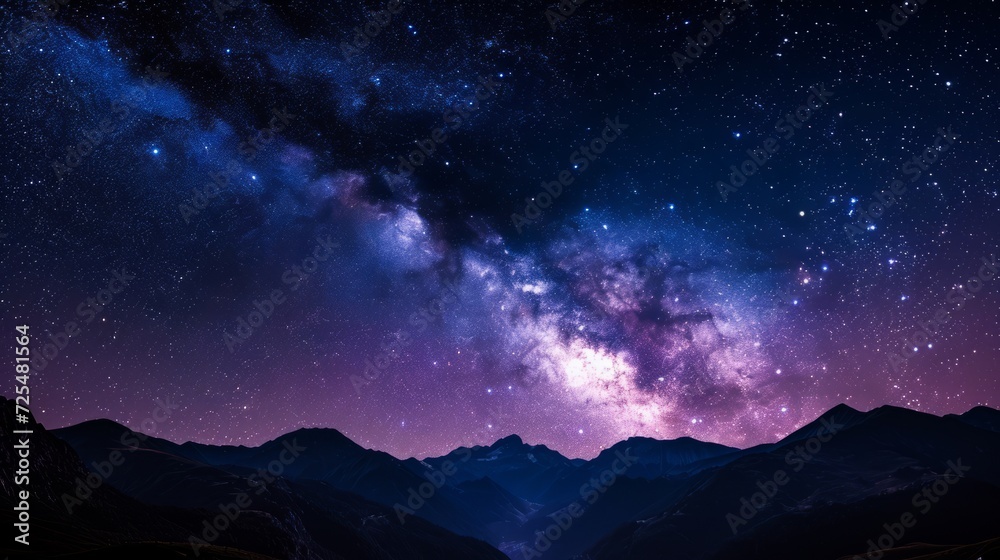 Vast, star-studded night sky, with the silhouette of majestic mountains framing the cosmic display. The image uses deep blues and purples. Milky way over the mountains in the evening.  - obrazy, fototapety, plakaty 