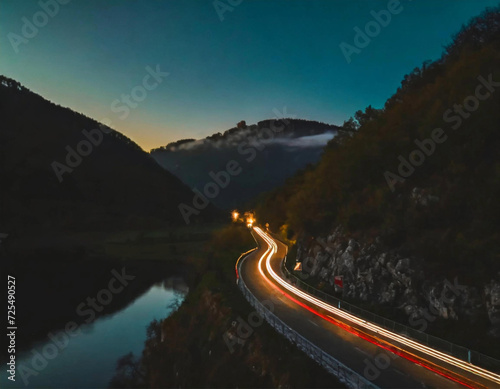 Traveling on a two-lane road at night with the reflection of the car's light