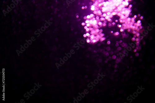 Abstract purple bokeh glitter lights defocused