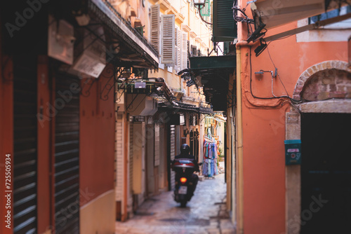 Fototapeta Naklejka Na Ścianę i Meble -  Corfu street view, Kerkyra old town beautiful cityscape, Ionian sea Islands, Greece, a summer sunny day, pedestrian streets with shops and cafes, architecture of historic center, travel to Greece