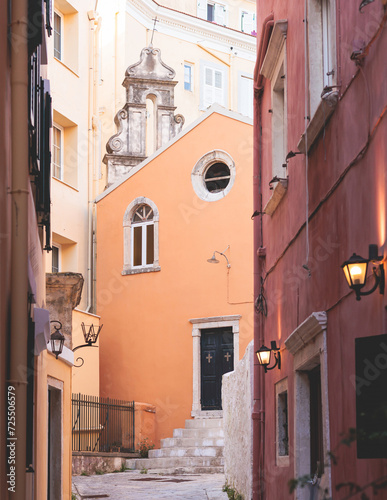 Fototapeta Naklejka Na Ścianę i Meble -  Corfu street view, Kerkyra old town beautiful cityscape, Ionian sea Islands, Greece, a summer sunny day, pedestrian streets with shops and cafes, architecture of historic center, travel to Greece