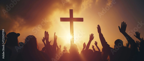 Worshippers gather at sunset, silhouetted against a glowing cross, a moment capturing devotion and communal belief.