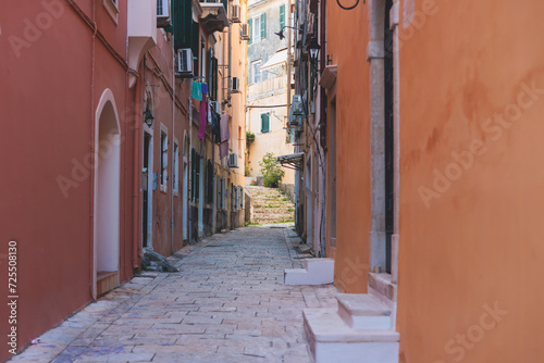 Fototapeta Naklejka Na Ścianę i Meble -  Corfu street view, Kerkyra old town beautiful cityscape, Ionian sea Islands, Greece, a summer sunny day, pedestrian streets with shops and cafes, architecture of historic center, travel to Greece