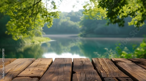 The empty wooden table top with blur background of summer lakes green forest. High quality photo