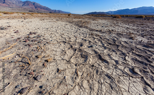 Dry cracked clay in the dry hot stone Mojave Desert in California in Death Valley NP