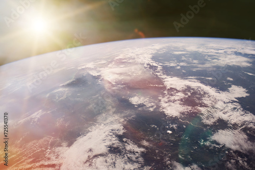 Fototapeta Naklejka Na Ścianę i Meble -  View of Earth planet in outer space with sunlight. Elements of this image furnished by NASA.