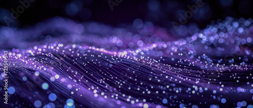 Purple glowing fiber optic cables with bokeh effect. 