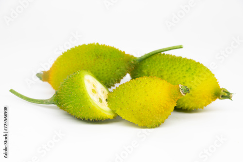 Spiny gourd or spine gourd also known as bristly balsma pear, prickly carolaho isolated on white background photo