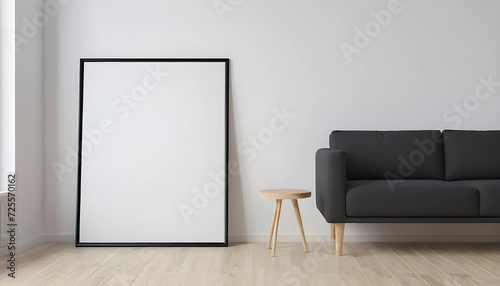 Blank-vertical-black-poster-frame-standing-on-light-wooden-floor-with-next-to-white-wall--Blank-poster-frame-mockup--Empty-picture-frame-mockup--Vertical-frame-mock-up--Blank-photo-frame--3d-rendering