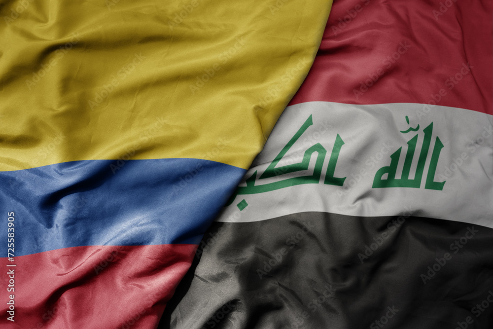 big waving national colorful flag of iraq and national flag of colombia .