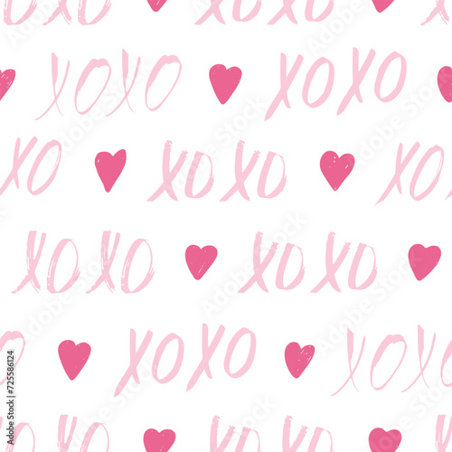 Seamless pattern with pink XOXO phrases and hearts. Romantic theme. Valentine's Day background. Vector illustration.
