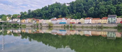 Panoramic view of colorful row of reflected houses at river Danube, Passau, Bavaria, Germany