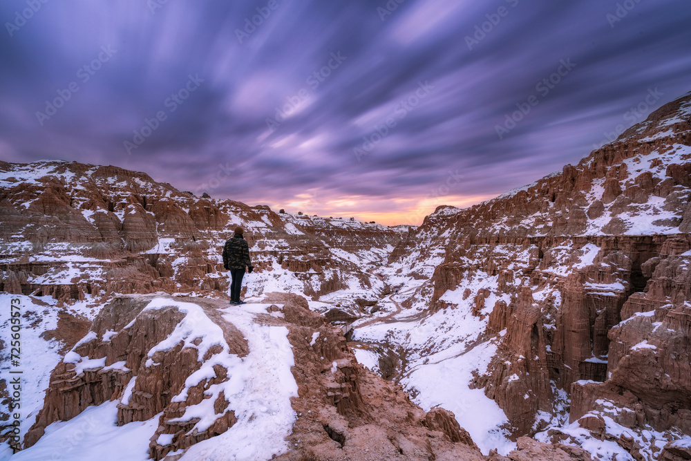 A lone hiker at Cathedral Gorge State Park in the winter 