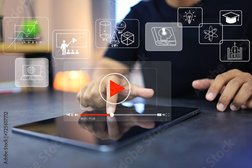 Foto Video lesson on tablet screen with student touch to scroll seeking bar select pl