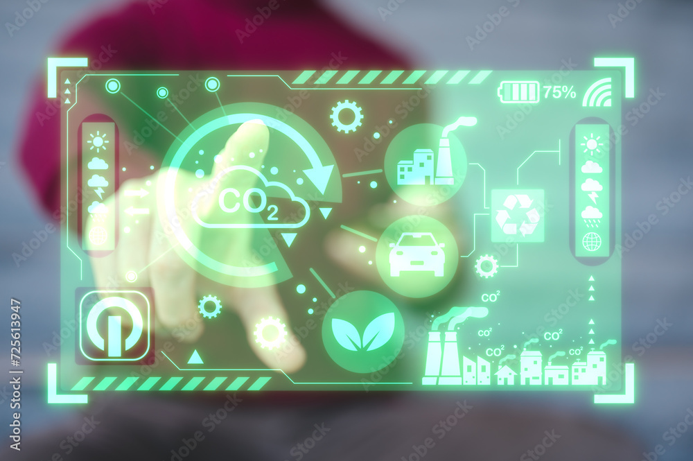 Reduce CO2 emissions and carbon footprint to limit global warming and climate change. Sustainable development and green business, man pointing at virtual diagram showing co2 emission icon Reduce CO2 emissions and carbon footprint to limit global warming and climate change. Sustainable development and green business, man pointing at virtual diagram showing co2 emission icon