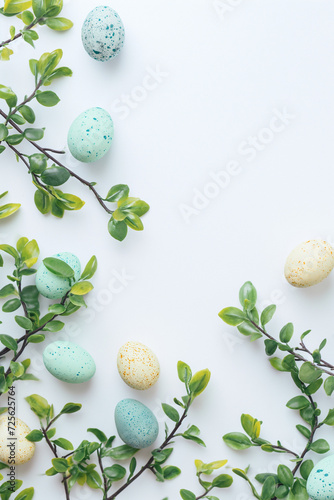 Painted Easter eggs and quail eggs on white background.