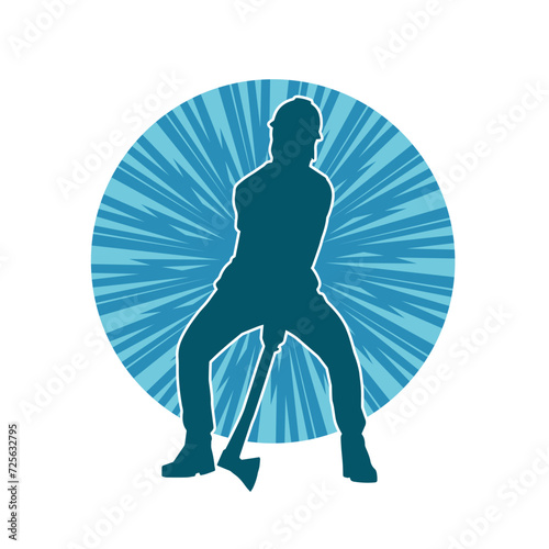 Silhouette of a worker in action pose using his axe tool.
