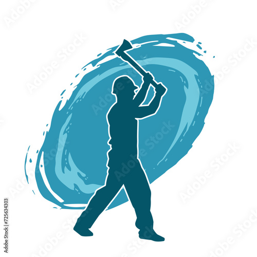Silhouette of a worker in action pose using his axe tool.