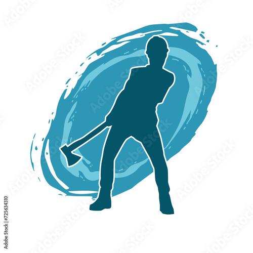 Silhouette of a worker in action pose using his axe tool.