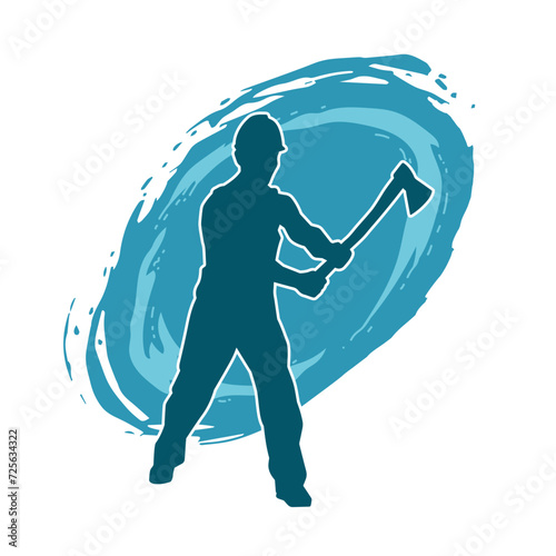 Silhouette of a worker in action pose using his axe tool.