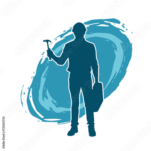 Silhouette of a worker carrying hammer tool. Silhouette of a worker in action pose using hammer tool.
