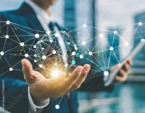 Businessman hand-holding network administration icons with seamless network connections. Facilitating the smooth growth of the IT infrastructure and ensuring the optimal functioning of businesses.