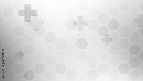 Abstract medicine and science with health, medical and healthcare grey background. Grid of hexagons and animated crosses. Looped motion graphics. photo