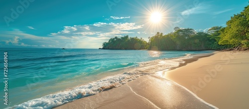 Summer photograph of the sun and a beach on an island.