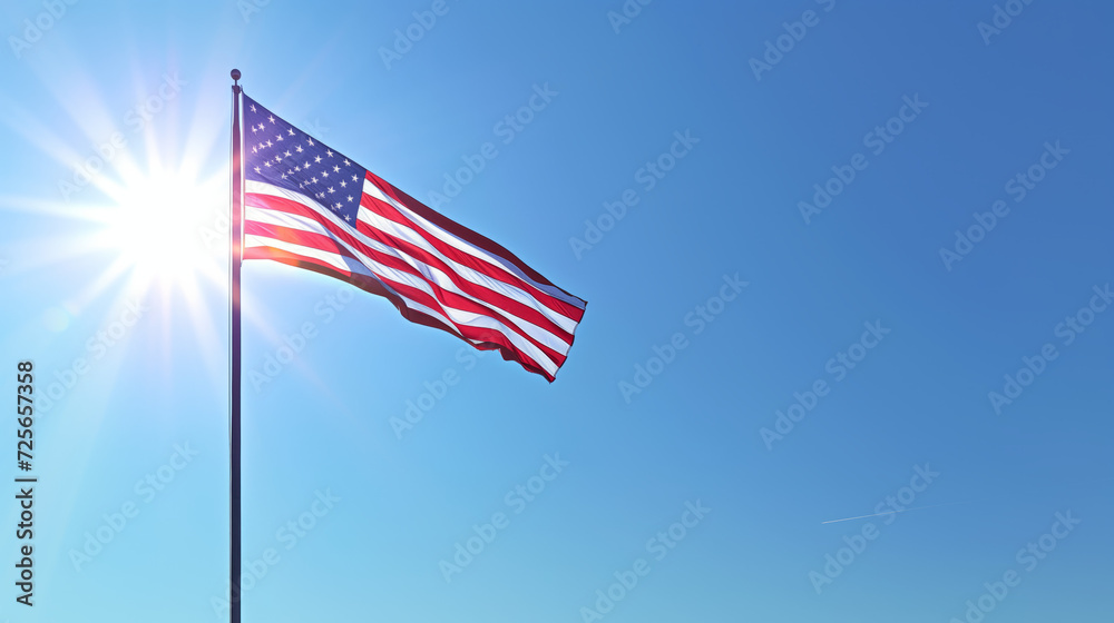 Patriotic Glory: American Flag and Sunburst. The American flag waving proudly against a bright blue sky, sunburst in the background.