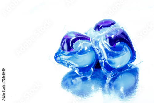 Capsules with detergent for washing machine on white background.Washing gel pods.Dishwasher capsules.Washing and clean things.Housework concept.