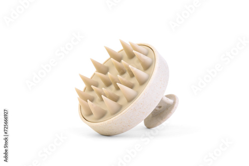 Fotografía Beige scalp massager for washing hair and hair growth stimulating isolated on white background