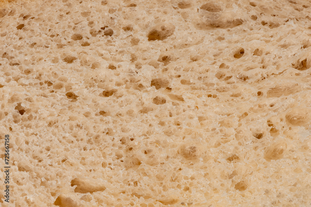 Macro closeup of a slice of loaf of freshly baked sourdough bread Macro closeup of a slice of loaf of freshly baked sourdough bread