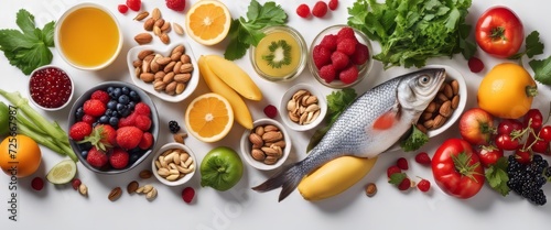 A set of healthy food. Fish, nuts, protein, berries, vegetables and fruits. On a white background