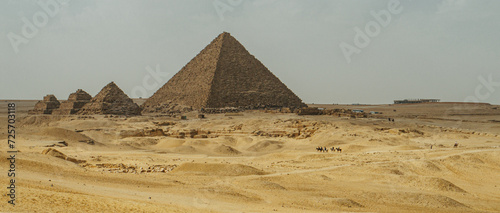 Desert landscape showcasing distant pyramids in Giza  Egypt