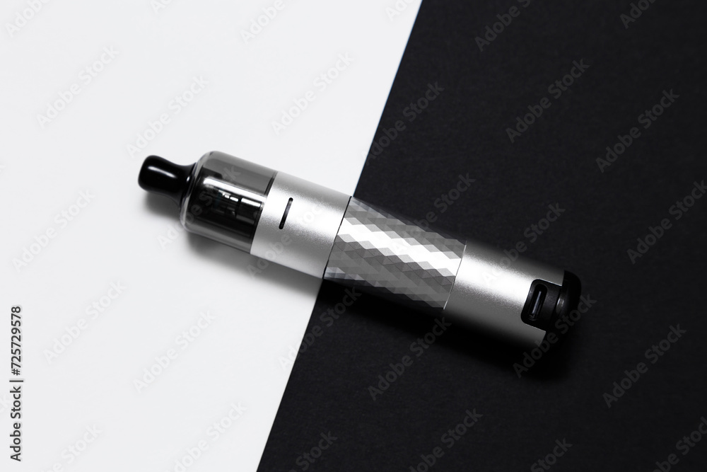 Vaping device, vape, pod, kit silver color on black and white background, top view Vaping device, vape, pod, kit silver color on black and white background, top view