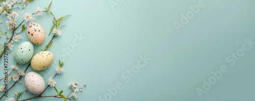 Easter minimalistic background with colorful eggs and flowers. Banner with space for text.