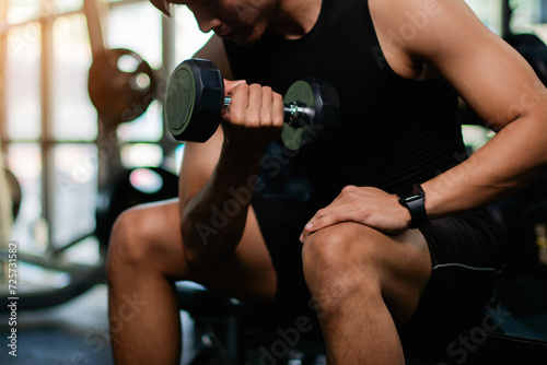 Lifting dumbbell exercises builds strong upper arm muscles. Exercise activities for health lovers and builds a good and strong figure. © FOTO SALE