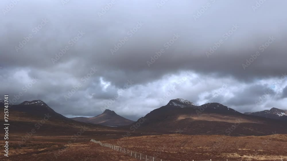 View of beautiful countryside in the Scottish highland with mountains, trees and sea View of beautiful countryside in the Scottish highland with mountains, trees and sea