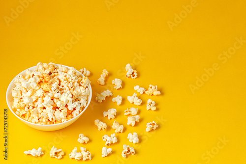 plate with popcorn on a yellow background