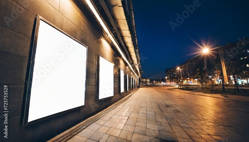 blank white advertising billboard on a office building wall at night mockup © Nathaniel