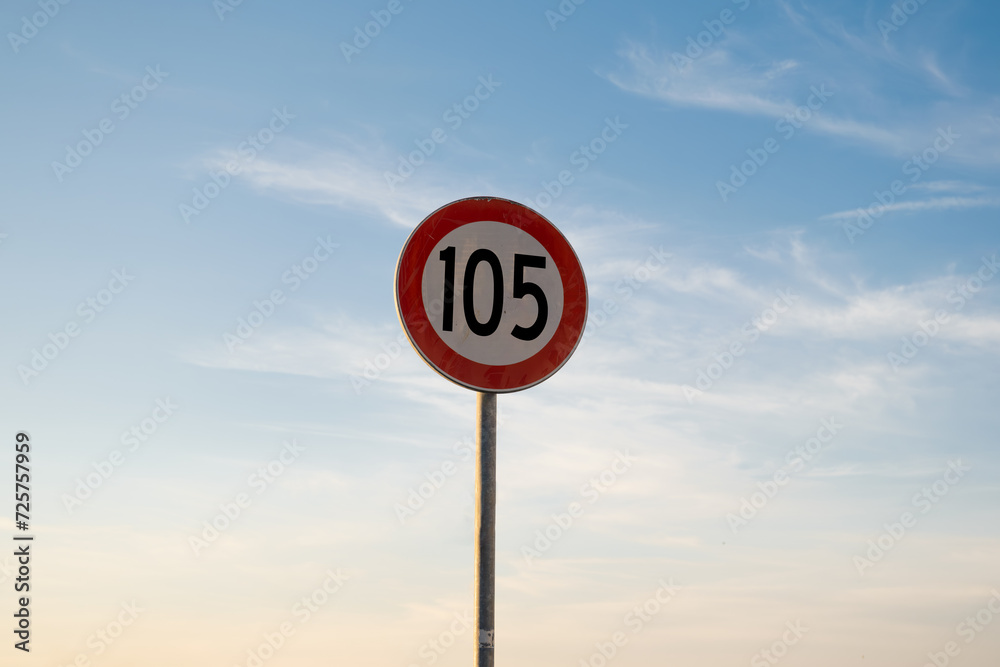 105 miles km maximum speed limit traffic sign isolated with sunset sky 105 miles km maximum speed limit traffic sign isolated with sunset sky