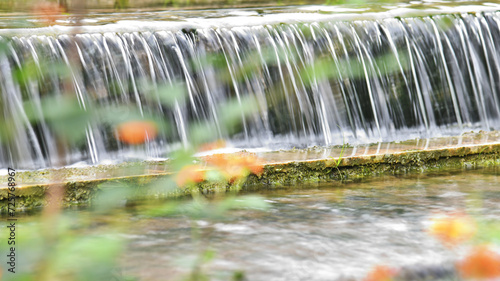 Water running down the stone step © xy