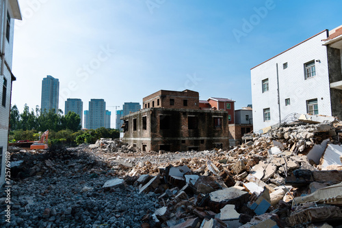 Contrast of demolished old house and modern skyscraper