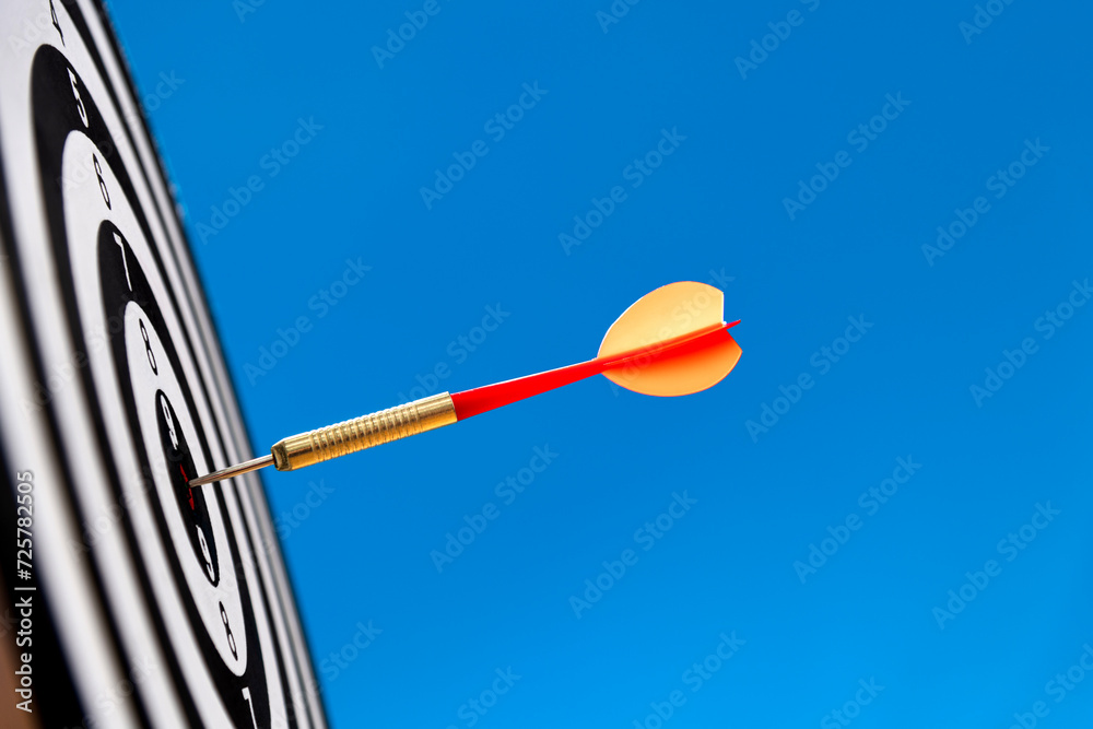 Dart hitting on center target Dart hitting on center target