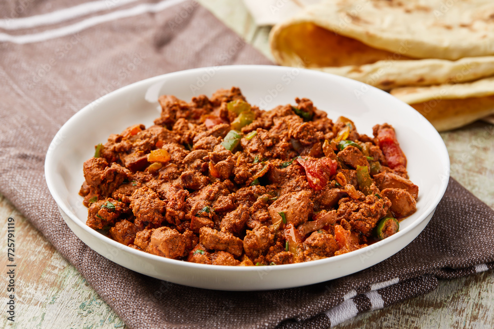 Chicken Liver masala kaleji served in dish isolated on table top view of arabic food Chicken Liver masala kaleji served in dish isolated on table top view of arabic food