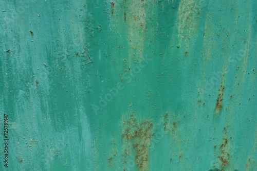 A green metal background with different divorces and shades on it.