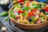 Salad with fusilli pasta, sausage, olives and cottage cheese. Italian food.