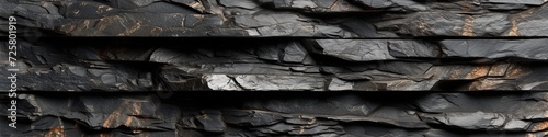 Dramatic 3D wall featuring dark schist stones, with shimmering mica inclusions, blending ruggedness with a touch of glamour.
