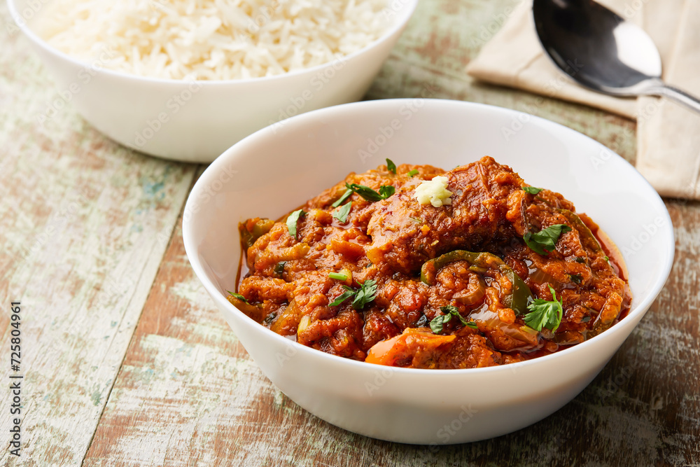 Fish Masala korma, curry karahi with boiled rice served in dish isolated on table top view of arabic food Fish Masala korma, curry karahi with boiled rice served in dish isolated on table top view of arabic food
